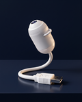 LUMIS car starlight projector, white capsule with USB gooseneck, on navy stone